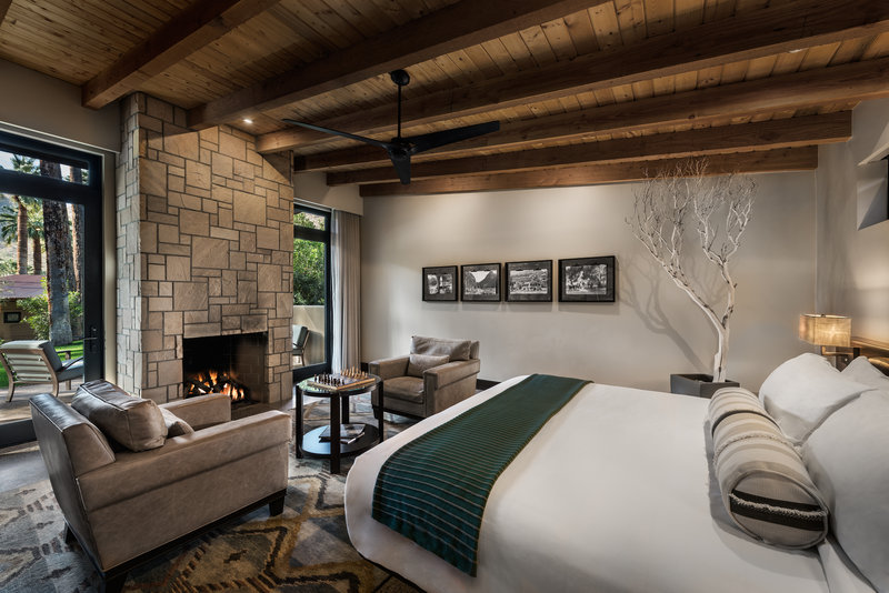 Spring Bungalow Bedroom with seating area and fireplace