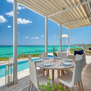 Three Bedroom Peninsula Oceanfront Coral Villa Outdoor Dining And View